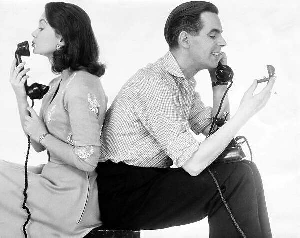Ian Carmichael and Janette Scott on the telephone, he is holding the wedding rings