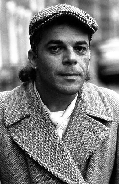 Ian Dury pictured in the street outside his house in Kennington, London