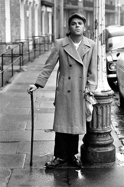 Ian Dury pictured in the street outside his house in Kennington, London