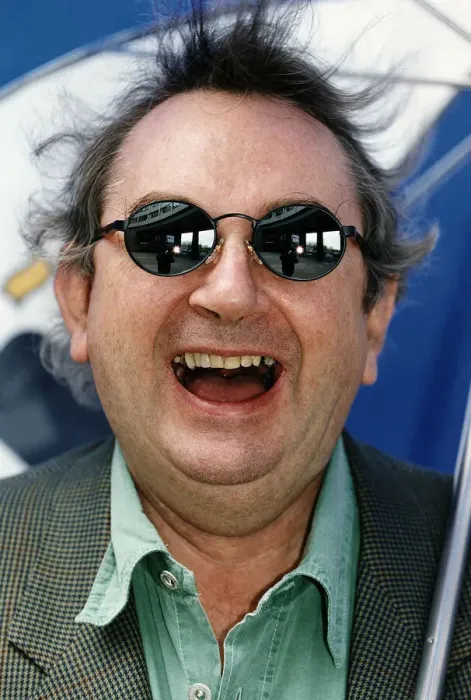 Framed Print : Ian McCaskill wearing a pair of Boots Dial Sunglasses holding umbrella