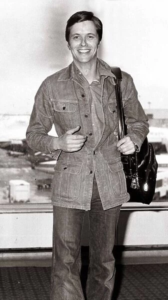 Ian Ogilvy Actor - June 1976. at the airport denim