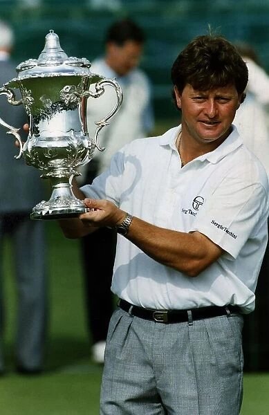 Ian Woosnam holding up the Scottish Golf Open Trophy