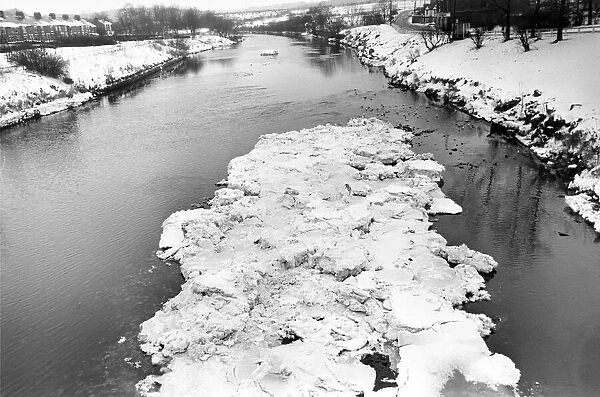Ice floes gliding down the river Wear at Fatfield Bridge in January 1987