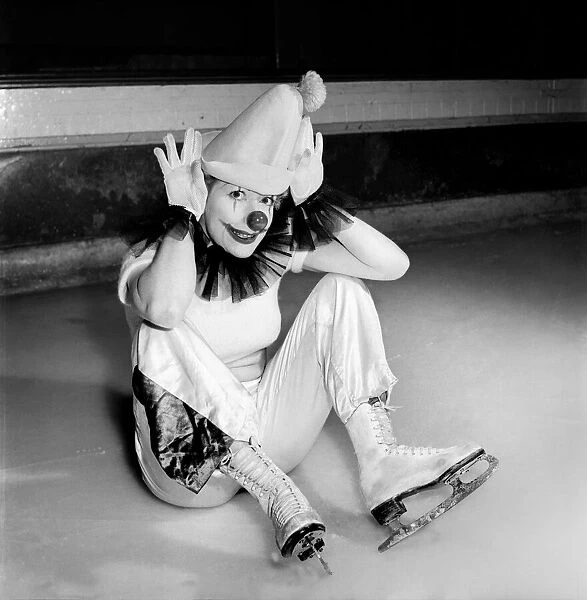 An Ice Skating female Clown performing. January 1953 D597-002