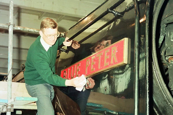 ICI Train Preservation, 4th January 1994. Dave Pearson polishes the name plate of