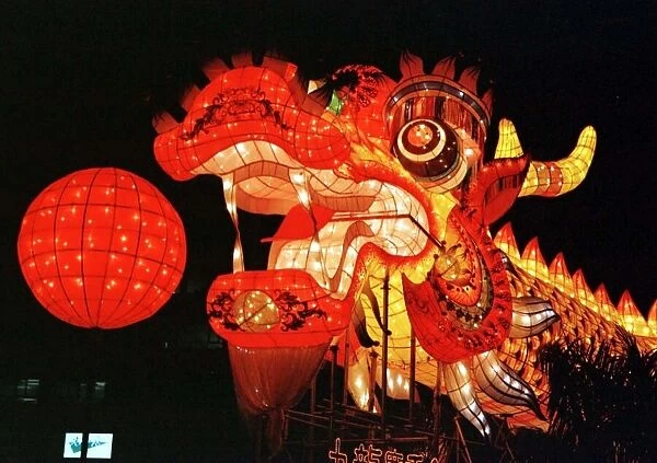 A illuminated dragon on Hong Kong harbour waterfront June 1997