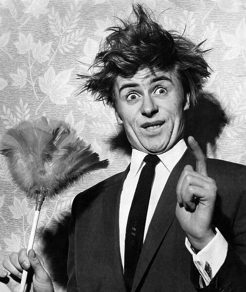 Impersonator Mike Yarwood seen here giving an impression of Ken Dodd. June 1965 P005919