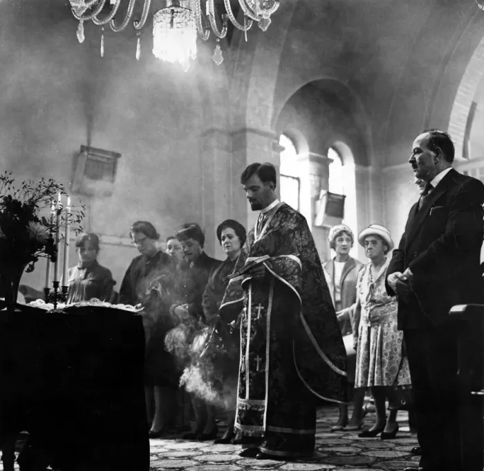Framed Print : Incense burns as Father Spiros Desylas intones during a service at the Greek Orthodox
