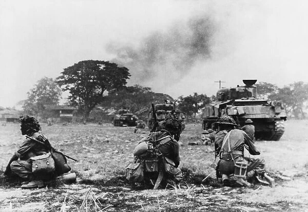 Indian tanks and infantry attack a village in Burma during Second World War