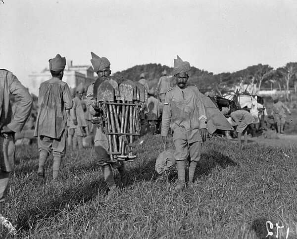 Indian troops carrying entrenching tools on their arrival at their holding camp in