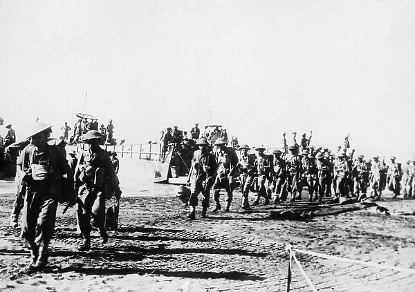 Indian troops disembarking from their landing craft after commandos had secured the beach