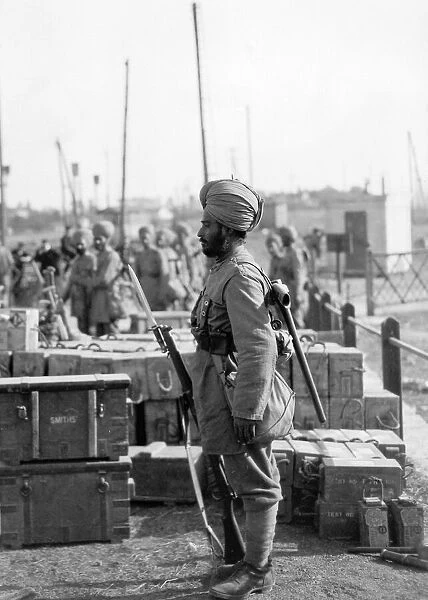 Indian troops in Orleans, France. Sentry guarding boxes of ammunition