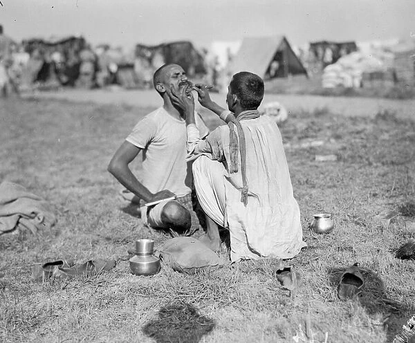 Indian troops, in their rest camp in Marseilles, seen here shaving before early morning