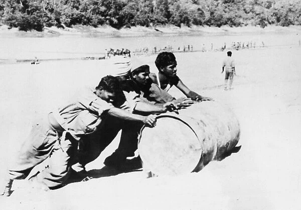 Indian troops move supplies on the east bank of the Chindwin. 30th December 1944