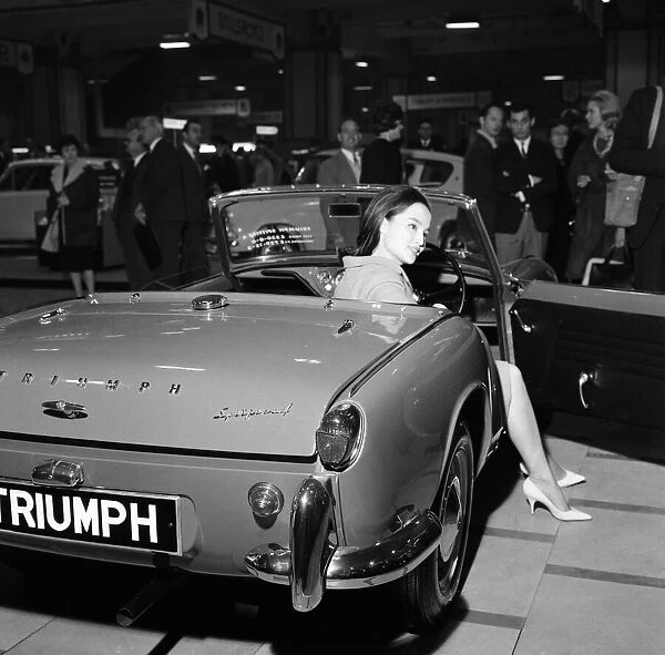 Indonesian model Mai Ling with the new Triumph Spitfire 4 at the Earls Court Motor show