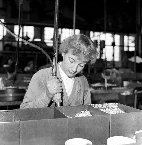 Industry: Factories. Women working on the production line at Henley