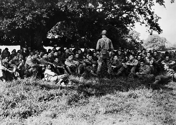 An infantry unit undergoes its briefing on receiving assignment for D-day