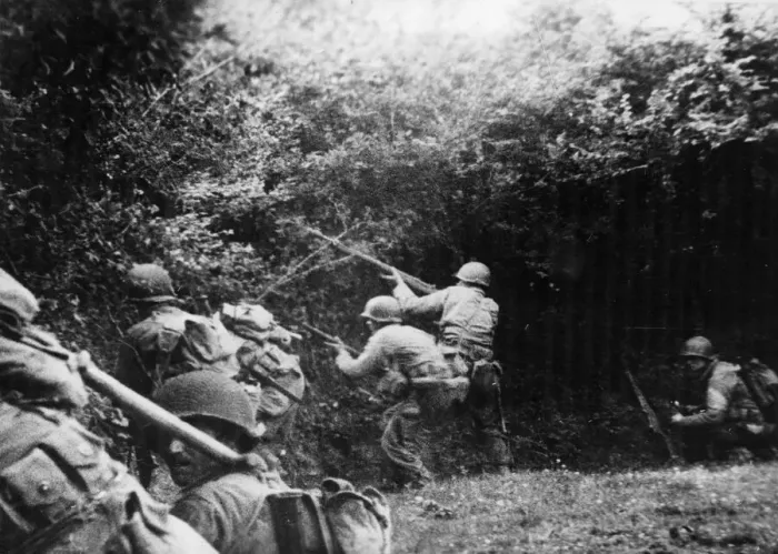 Framed Print : US infantrymen, fired at by an enemy German sniper, take to the ditch Framed Print : US infantrymen, fired at by an enemy German sniper, take to the ditch