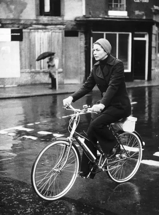 Framed Print : Ingrid Bergman actress riding her bike in the rain dbase MSI brochure Framed Print : Ingrid Bergman actress riding her bike in the rain dbase MSI brochure