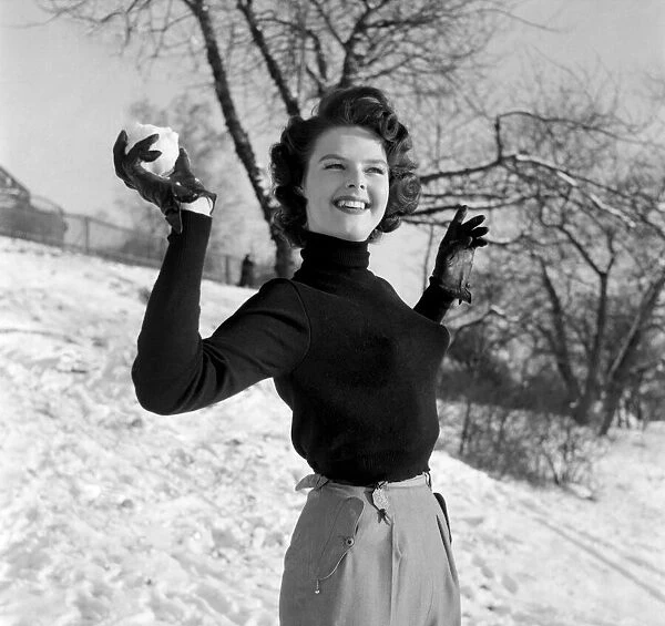 Ingrid Larsson - Swedish calander girl seen here throwing a snow ball. January 1953 D236