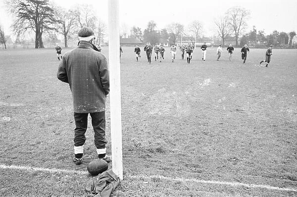 Injured England Skipper Dick Greenwood looks on as the rest of the England Rugby Union