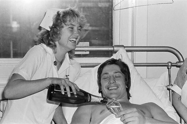Injured English rugby player Tony Bond, with a broken leg in hospital