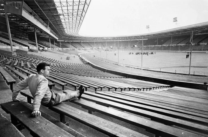 Framed Print : Injured Liverpool footballer Gordon Milne looks out over Wembley Stadium as his teammates