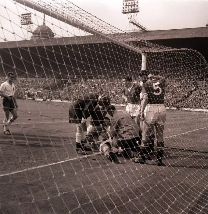 Framed Print : The injured Manchester United goalkeeper, Gregg, receiving attention after Framed Print : The injured Manchester United goalkeeper, Gregg, receiving attention after