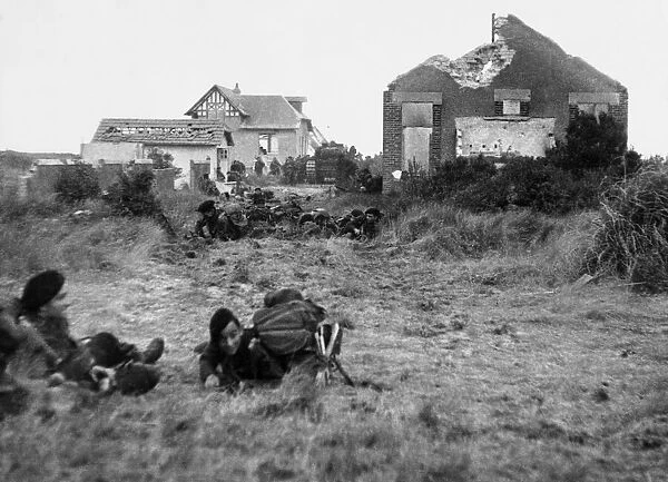 Inland from French beaches under shell, mortar and sniper fire