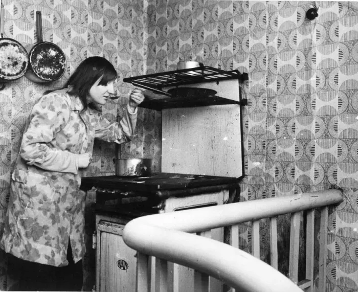 Framed Print : The Interior of slum housing in an area of Newcastle - Jaqcueline tastes her cooking Framed Print : The Interior of slum housing in an area of Newcastle - Jaqcueline tastes her cooking