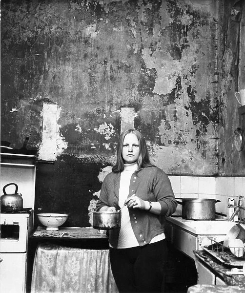 The Interior of slum housing in an area of Newcastle - Mrs Campbel in her kitchen where