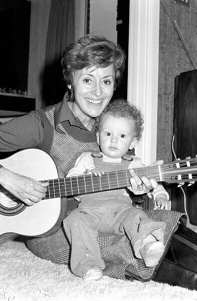 International singer star: Caterina Valente serenades her son. February 1975 75-00827