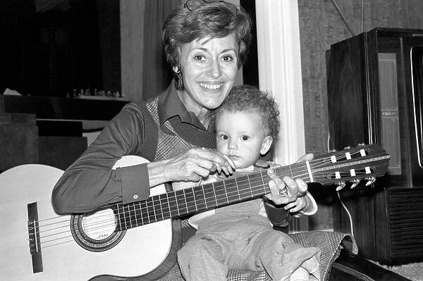 International singer star: Caterina Valente serenades her son. February 1975 75-00827-002