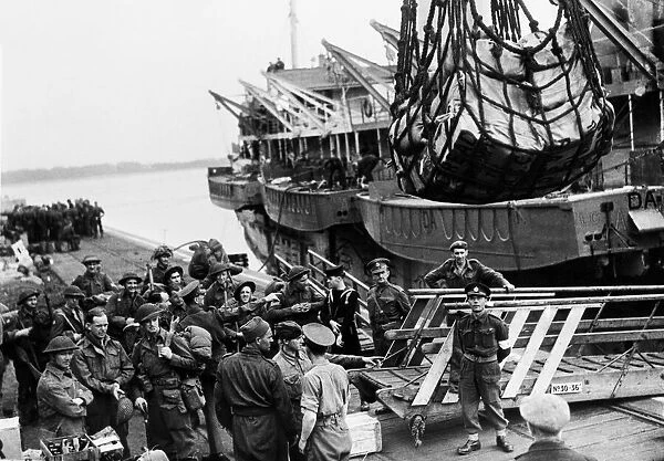 Invasion Day scenes. Canadian troops waiting to go aboard an L. S. I