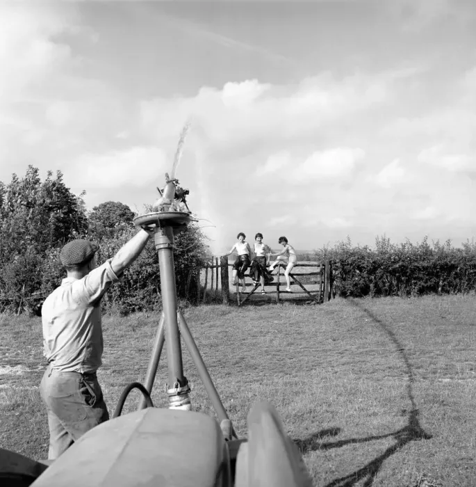 Framed Print : Inventions: The Rain Gun': A farmer seen here testing a new kind of irrigation Framed Print : Inventions: The Rain Gun': A farmer seen here testing a new kind of irrigation