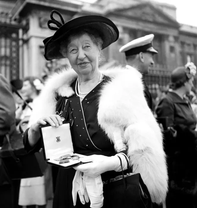 Framed Print : Investiture, Buckingham, Palace'. Miss M. Bradden, seen here with her M. B