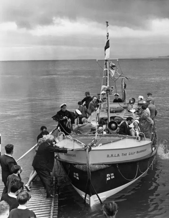 Framed Print : Invited guests being brought being given a trip around the bay on the Llandudno lifeboat