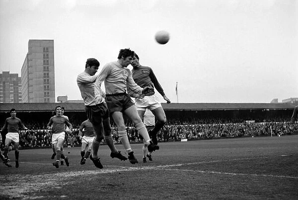 Ipswich attack - Brown heads away a corn are kick. McNeil of Ipswich is in picture