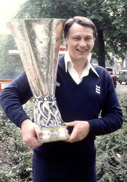 Ipswich Town manager Bobby Robson holds aloft the UEFA Cup trophy after his side defeated