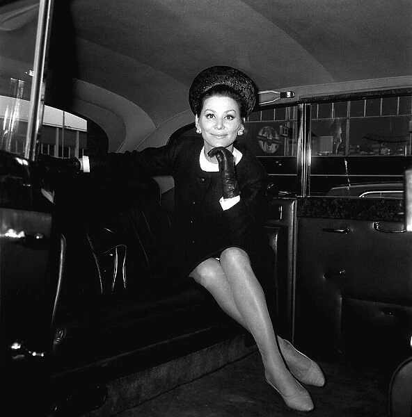Irena Demick French actress at London Airport May 1965 sitting in the back of a car