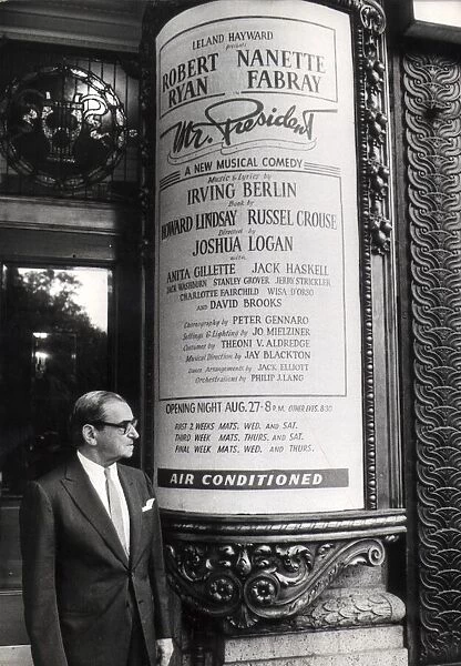 Irving Berlin stood by a poster for his new show, Mr President