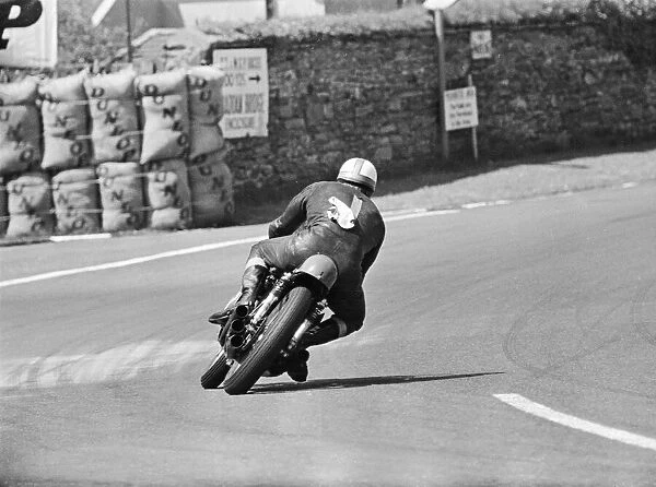 Isle of Man TT Races -250cc Event. Mike Hailwood on his way to set a new average