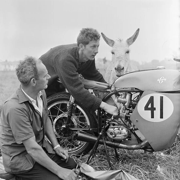 Isle of Man TT Races. Bill Hawthorne and his mechanic Pat Lynch tuning up his BSA