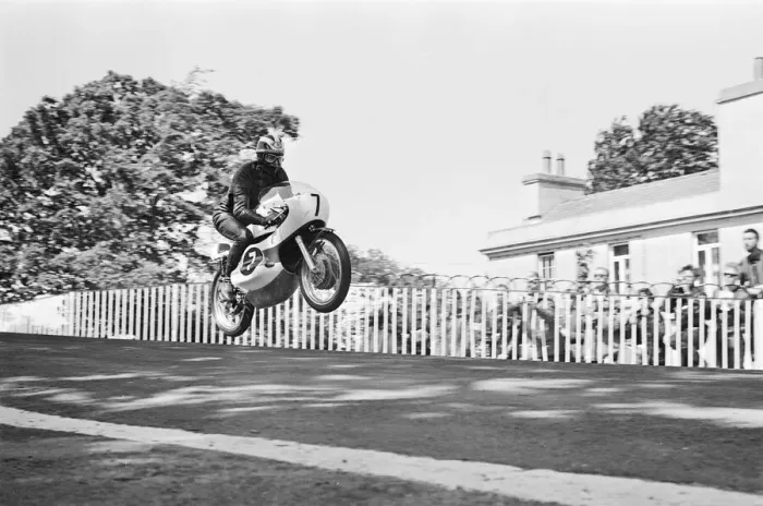 Framed Print : Isle of Man TT Races - Junior International. Winner Jim Redman goes over Ballaugh