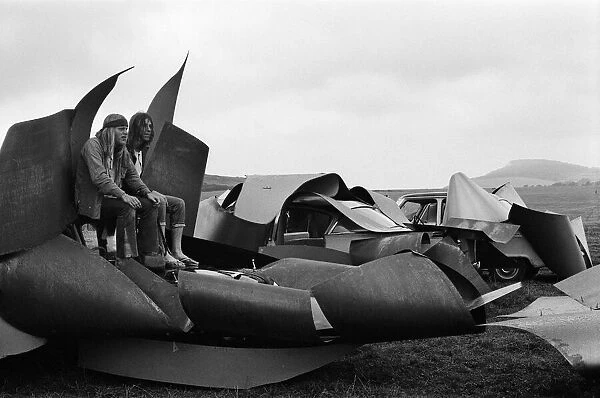 Isle of Wight Festival. Two Swedish hippy types sitting on top of cars that look like
