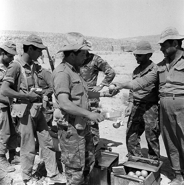 Israeli soldiers line up for food in the Negev desert June 1967