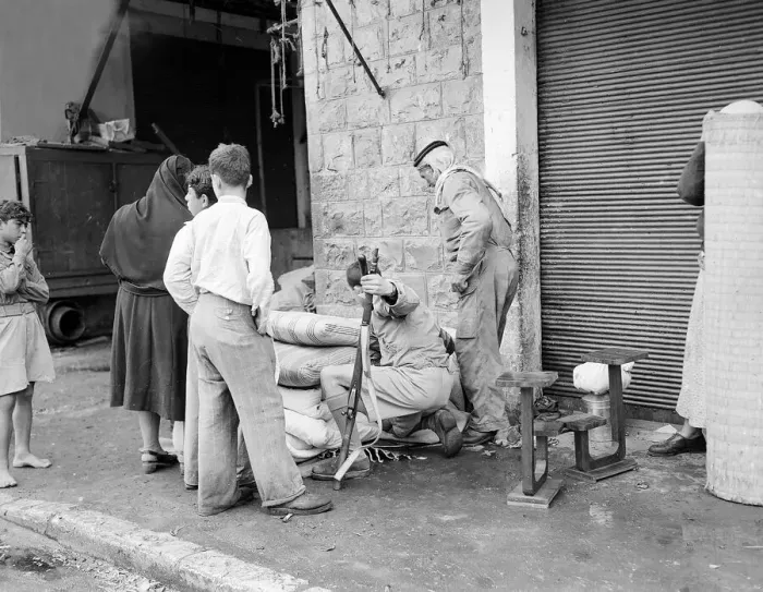 Framed Print : Isreali officer checks belongings of arab family Framed Print : Isreali officer checks belongings of arab family