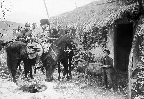 The Italian Cavalry on patrol in the mountains making enquiries at a village