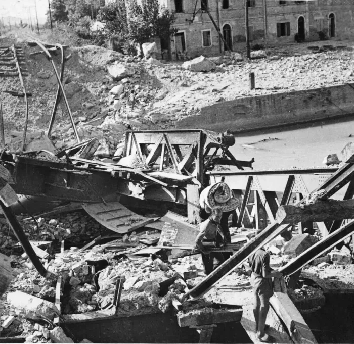 Framed Print : Italian civilians cross the damaged railway bridge at Pesaro Framed Print : Italian civilians cross the damaged railway bridge at Pesaro