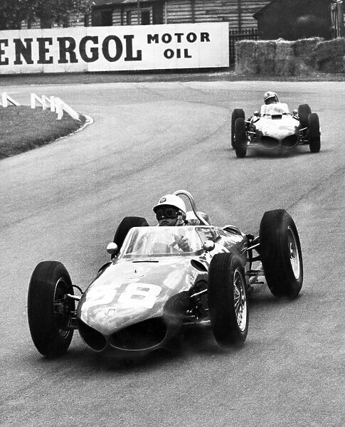 Italian motor racing driver Giancarlo Baghetti leads fellow Ferrari teammate Willy Von